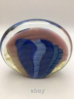 Art glass in pink, blue & black oval shaped paperweight signed by Paul Bendzunas