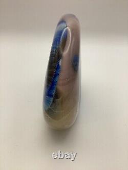 Art glass in pink, blue & black oval shaped paperweight signed by Paul Bendzunas