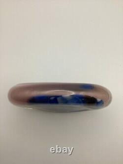 Art glass in pink, blue & black oval shaped paperweight signed by Paul Bendzunas