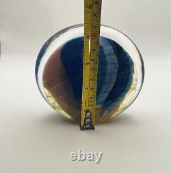 Art glass in pink, blue & black oval shaped paperweight signed by Paul Bendzunas