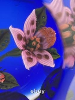 John Deacons Faceted Lampwork Pink Flowers/Ladybug On Blue Base Paperweight
