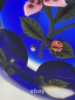 John Deacons Faceted Lampwork Pink Flowers/Ladybug On Blue Base Paperweight