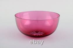 Set of twelve Holmegaard bowls in pink art glass. Danish design, mid-20th C