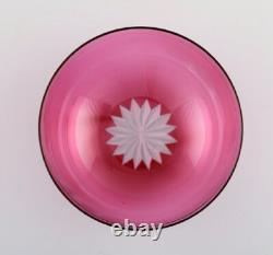 Set of twelve Holmegaard bowls in pink art glass. Danish design, mid-20th C