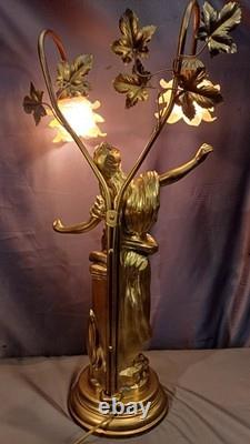 Tall Art Nouveau Auguste Moreau style figurine lamp. Frilled pink glass shades