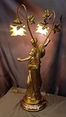 Tall Art Nouveau Auguste Moreau style figurine lamp. Frilled pink glass shades