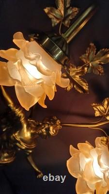 Tall Art Nouveau Auguste Moreau style figurine lamp. Frilled pink glass shades