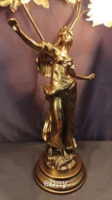 Tall Art Nouveau Auguste Moreau style figurine lamp. Frilled pink glass shades