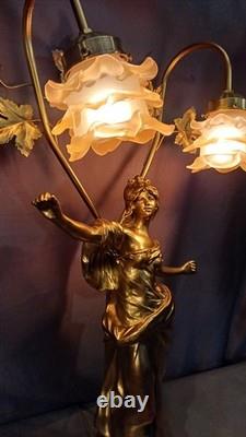 Tall Art Nouveau Auguste Moreau style figurine lamp. Frilled pink glass shades