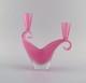 Two-armed Murano candle holder in pink hand-blown art glass. Italian design