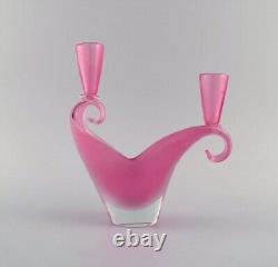 Two-armed Murano candle holder in pink hand-blown art glass. Italian design