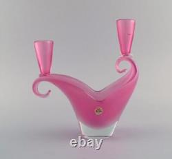 Two-armed Murano candle holder in pink hand-blown art glass. Italian design