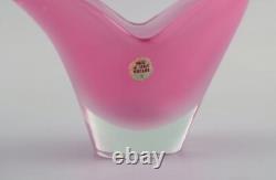 Two-armed Murano candle holder in pink hand-blown art glass. Italian design