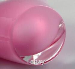 Two-armed Murano candle holder in pink hand-blown art glass. Italian design