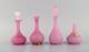 Two vases and two flacons in pink mouth-blown art glass decorated with gold